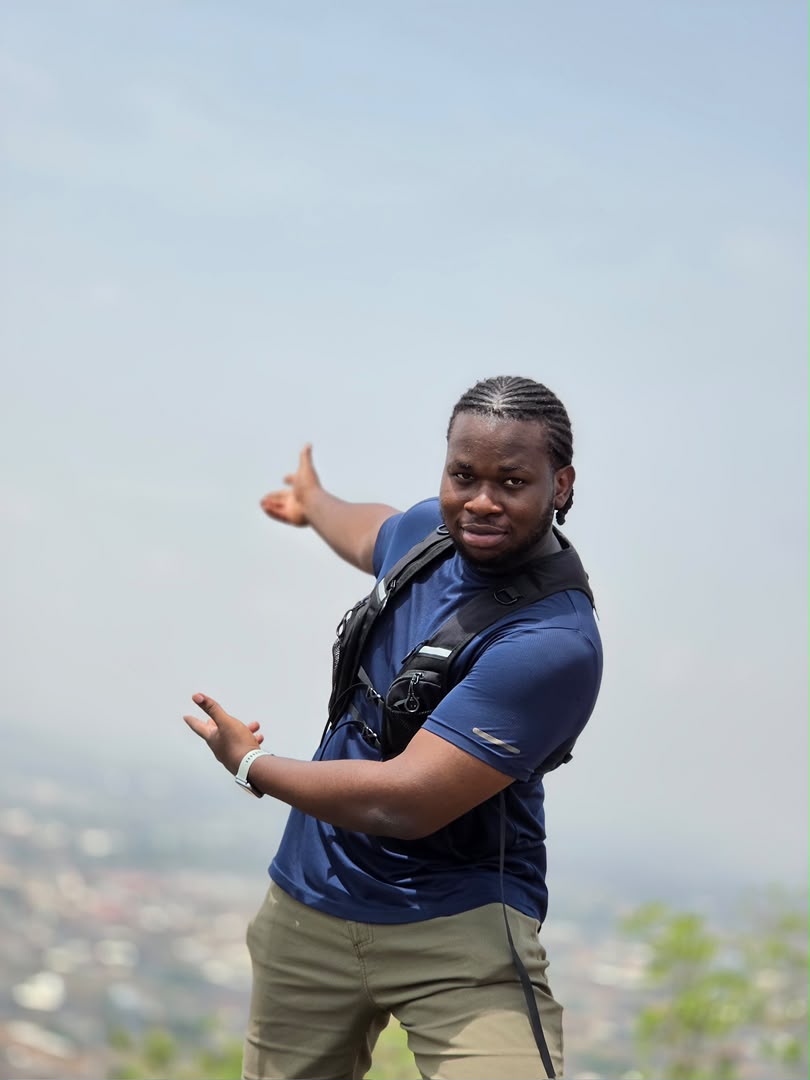 Noble Ugorji outdoors overlooking a mountain landscape